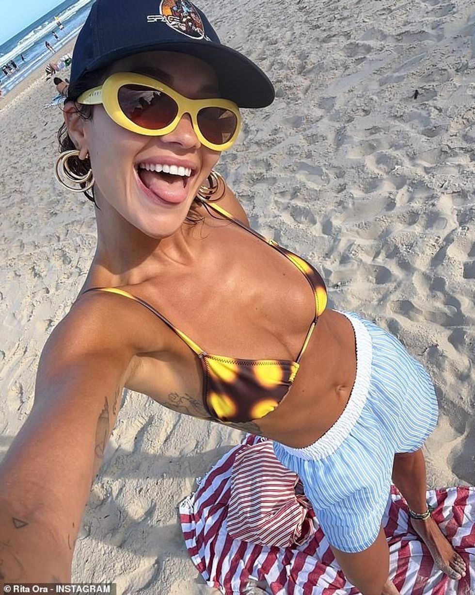 94586845 14332729 Rita Ora is having the time of her life on Australia s Gold Coas a 10 1738054977959
