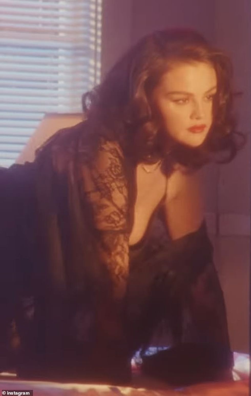 96184947 14497907 The 32 year old singer wore a black negligee flashing her perky a 108 1741935908437