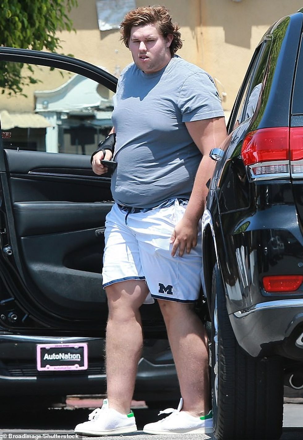 97195913 14601445 Dressed casually in a fitted navy tee and gray shorts the once r m 6 1744430023159