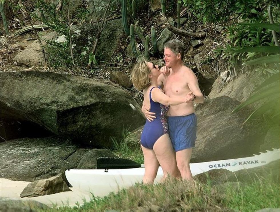 98 ST. THOMAS, UNITED STATES: File photo dated 04 January 1998 shows US President Bill Clinton and First Lady Hillary Clinton dancing on the beach of Megan Bay, St. Thomas, US Virgin Islands shortly after taking a swim. A poll of New York voters released 05 June 2003 finds them divided on the issue of why the former First Lady Hillary Clinton penned her soon-to-be released memoirs. Twenty-eight percent said the book was meant to lay groundwork for a future presidential run, while 27 percent believe her main motivation was to
