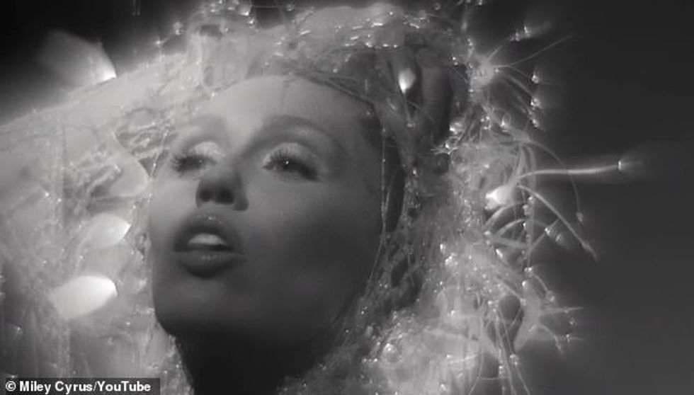 98234661 14696917 The video for the song also dropped on Friday and is a simple bl a 17 1746825407632