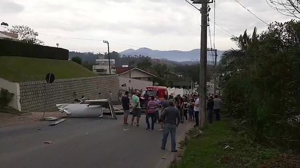 A crowd of locals gathered at the scene and some onlookers said the people in the plane were fortunate that the plane didn't catch fire from escaping fuel