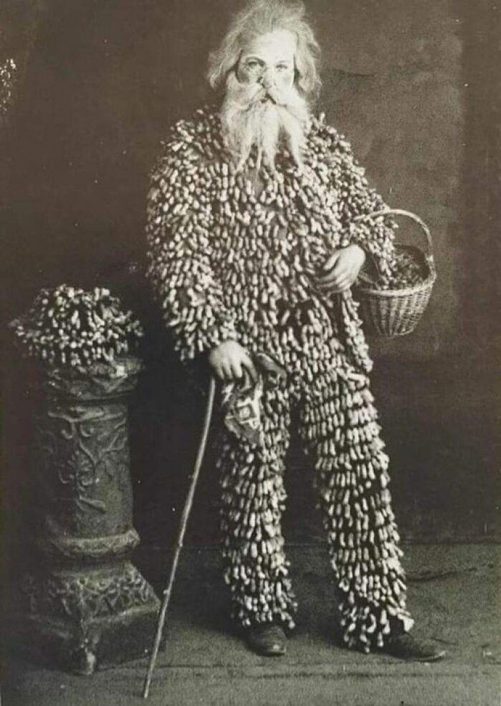 A Peanut Vendor From 1890, Wearing A Suit Made Of Peanuts