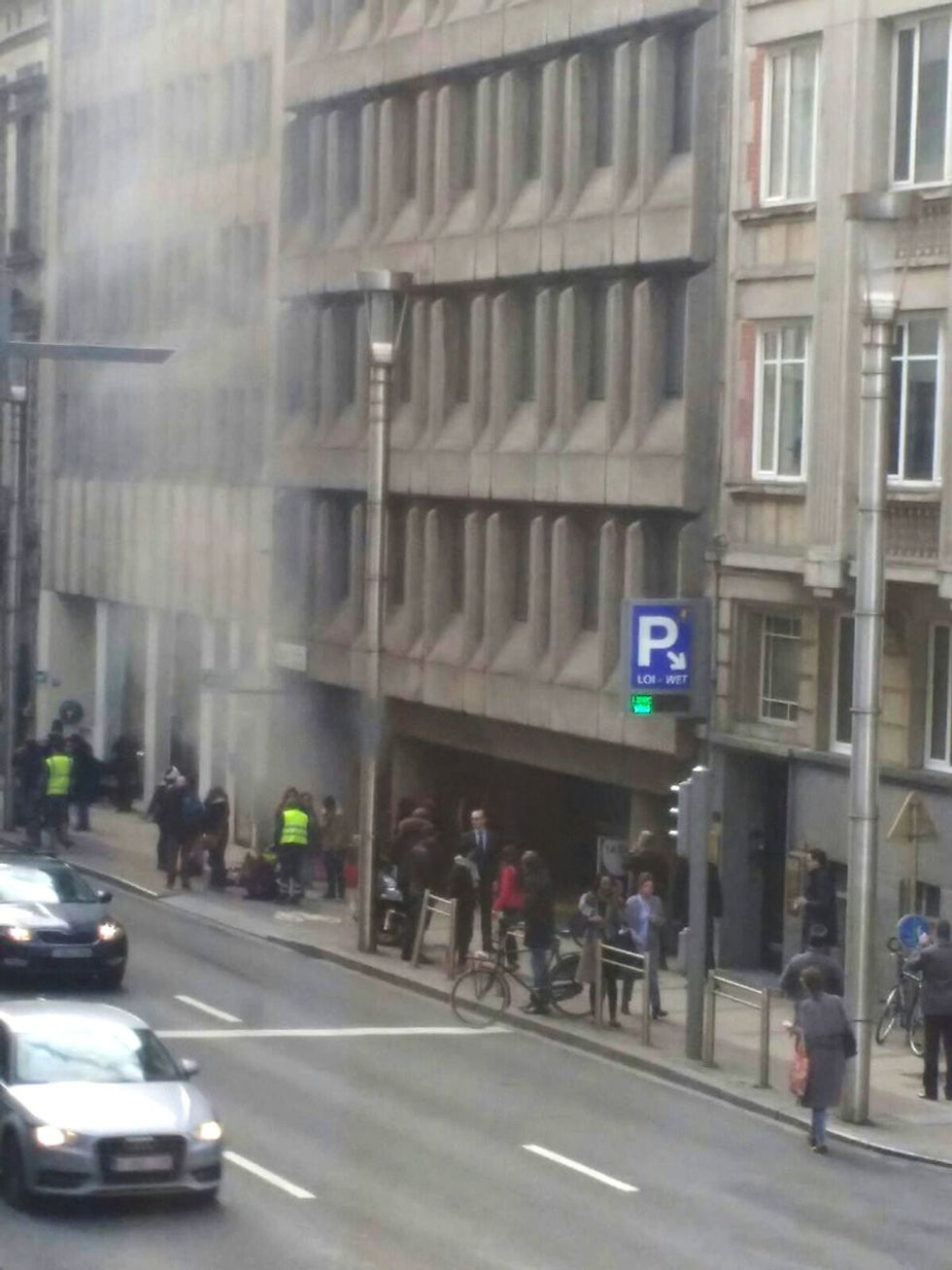 A picture taken on March 22, 2016 shows smoke rising from the Maalbeek underground, in Brussels, following a blast at the station close to the capital's European quarter. The Brussels metro service was being shut down on March 22, its operator said. The measure came after a rush-hour explosion at Maalbeek station with TV images showing black smoke pouring from the station entrance. / AFP / Belga / Seppe KNAPEN / Belgium OUT (Photo credit should read SEPPE KNAPEN/AFP/Getty Images)