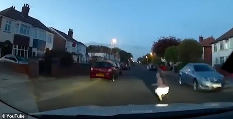 A taxi driver narrowly misses hitting a young girl who run out in front of his cab on VE Day last week