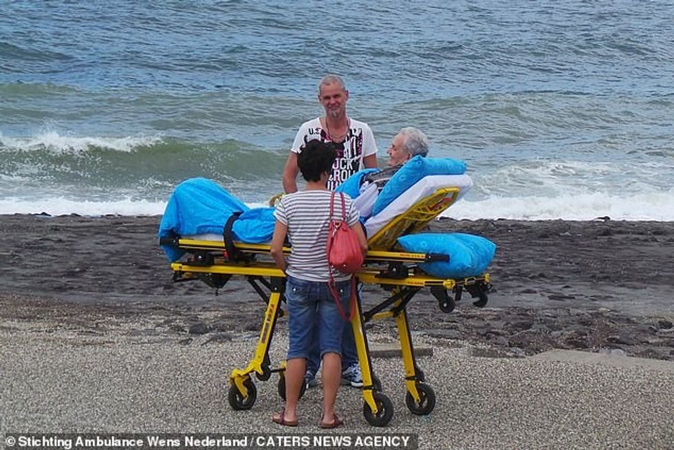 A terminally ill patient takes a trip to the beach. Mr Veldboer said: 'It's not only about helping the patient, we also help their families and friends create beautiful memories. We know we cannot make them better but we give them so much joy in their last days and it's special'