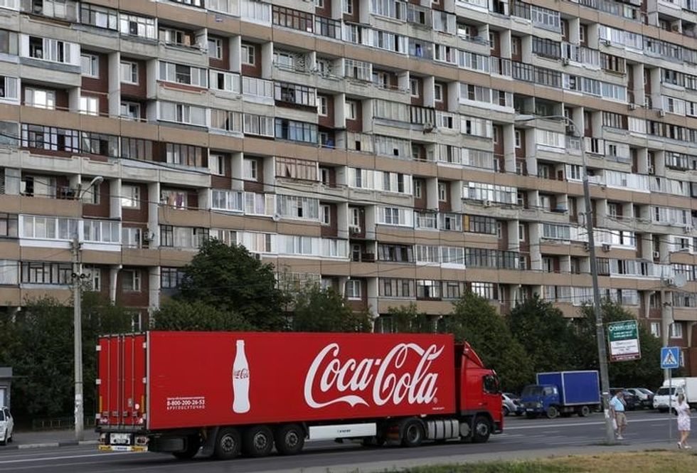 A truck transports bottles from the Coca-Cola company on the outskirts of Moscow, August 6, 2014. REUTERS/Maxim Shemetov