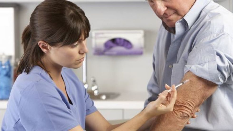 adult man getting vaccinated istock 1