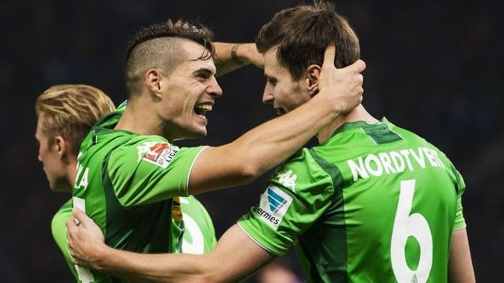 AFP PHOTO / ODD ANDERSEN RESTRICTIONS: DURING MATCH TIME: DFL RULES TO LIMIT THE ONLINE USAGE TO 15 PICTURES PER MATCH AND FORBID THE IMAGE SEQUENCES TO SIMULATE VIDEO. == RESTRICTED TO EDITORIAL USE == FOR FURTHER QUERIES PLEASE CONTACT DFL DIRECTLY AT + 49 69 650050 (Photo credit should read ODD ANDERSEN/AFP/Getty Images)