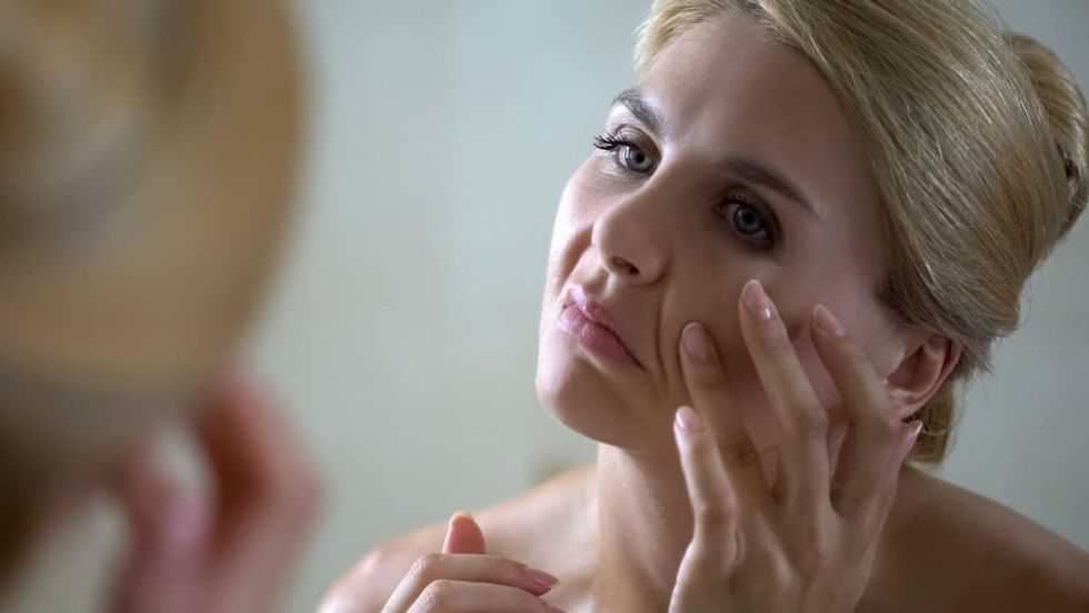 aging skin nasolabial folds looking mirror 1480