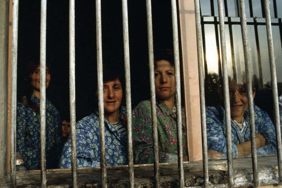 ALBANIA. Sarande. Maternity Hospital. Women have to attend the hospital for 4-5 days and during this time are not allowed visits from their immediate family of other visitors. Husbands and friends deliver presents through the barred windows. 1990.