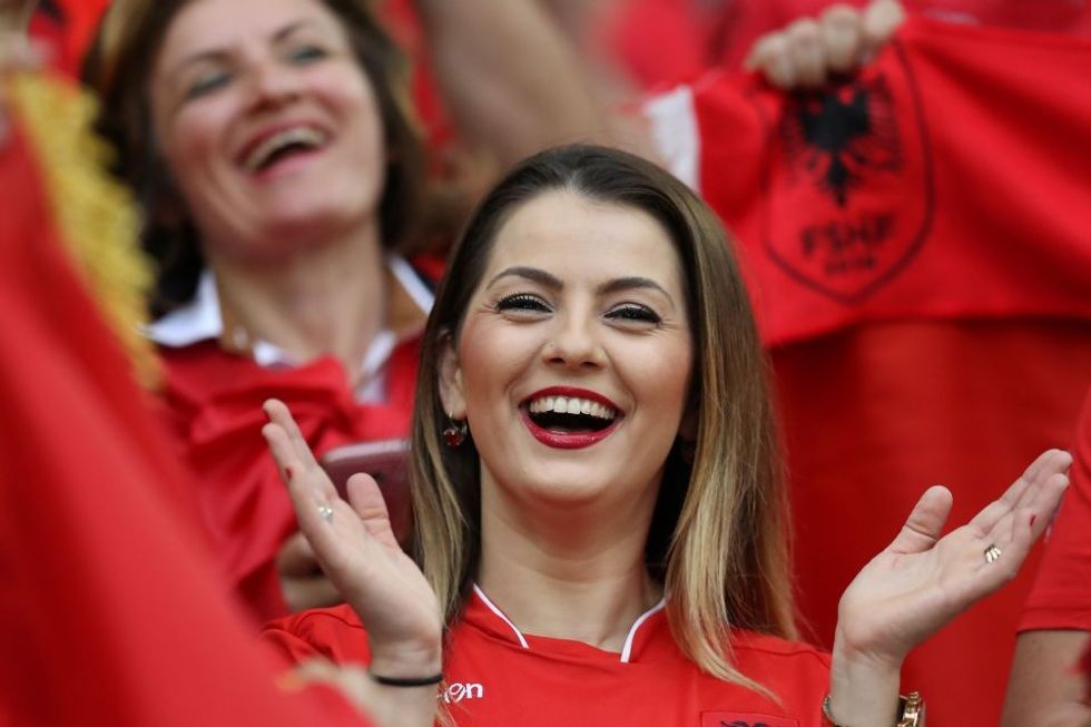 An Albanian fan claps as she waits for the start of the Euro 2016 group A football match between France and Albania at the Velodrome stadium in Marseille on June 15, 2016. / AFP PHOTO / Valery HACHEVALERY HACHE/AFP/Getty Images