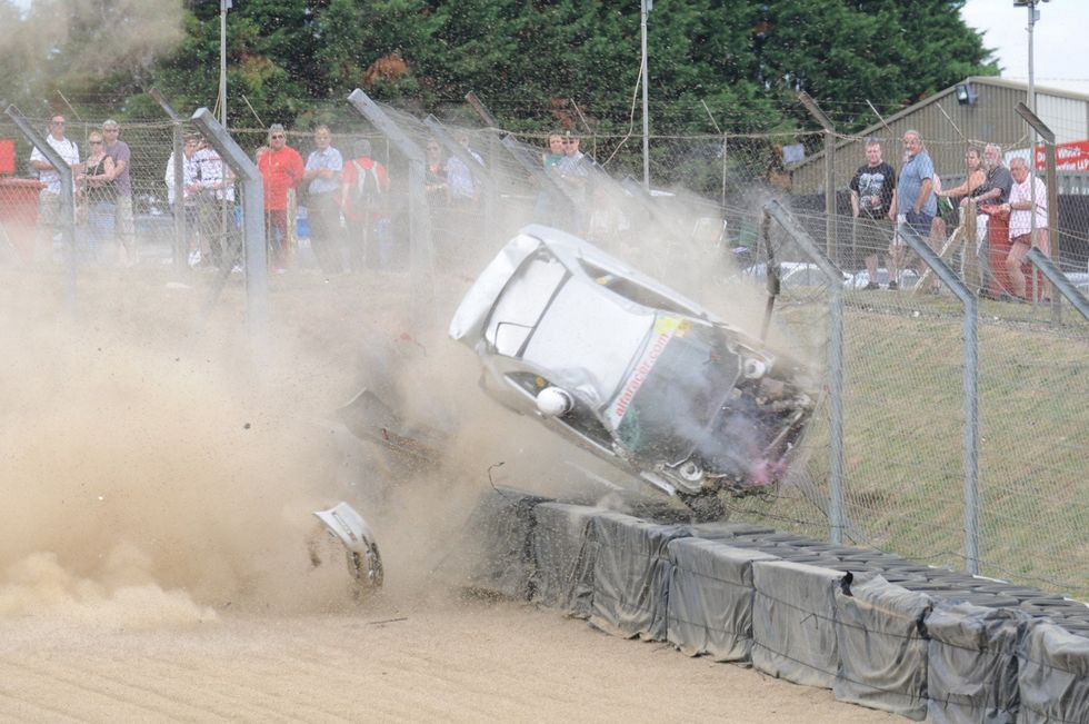 Andrew Bourke barrel-rolling at Brands Hatch when he suffered a brake fault at the end of the straight and clipped another car at an estimated 130mph. See SWNS copy SWROLL: This incredible sequence of pictures capture a British racing driver barrel-rolling with his head out of the WINDOW - but he miraculously walks away unscathed. Andrew Bourke was on a qualifying lap at Brands Hatch when he suffered a brake fault at the end of the straight and clipped another car at an estimated 130mph. The collision sent his Alfa Romeo GTV into a violent spin - the force of which pushed his helmet out of the window. His head can he seen perilously dangling out of the vehicle as it rolls several times before slamming into the safety netting and landing on its wheels. Remarkably Mr Bourke, of Corby, Northants., climbed out of the wreckage and walked away. He was later checked over by paramedics and given the all-clear.