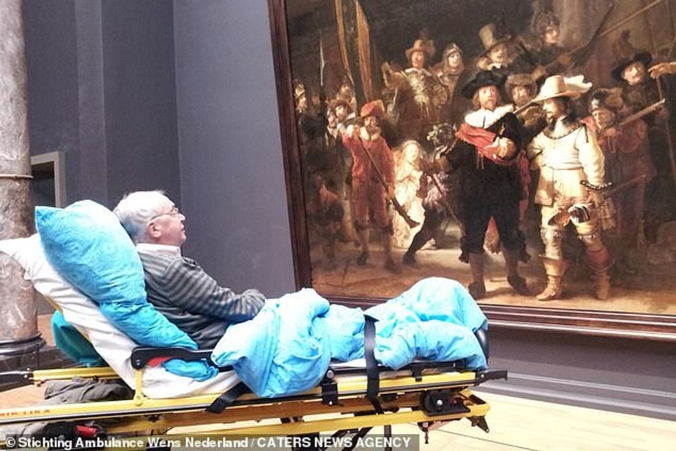 Another quite popular wish is for patients to see their favourite piece of art for one last time and Mr Veldboer delivered- he arranged many trips to the museum, after the opening hours so people could admire the art. The most recent one was at the Rijksmuseum in Amsterdam, where people were able to see Rembrandt's exhibition (pictured: a man looks at 'The Night Watch' by Rembrandt)