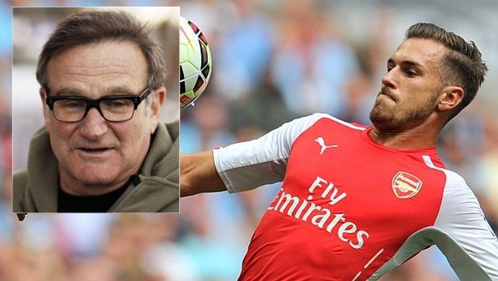 Arsenal's Welsh midfielder Aaron Ramsey eyes the ball during the FA Community Shield football match between Arsenal Manchester City at Wembley Stadium in north London on August 10, 2014. AFP PHOTO / GLYN KIRK -- NOT FOR MARKETING OR ADVERTISING USE / RESTRICTED TO EDITORIAL USE