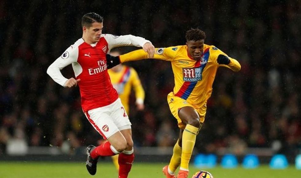 Arsenals Granit Xhaka in action with Crystal Palaces Wilfried Zaha e1483300658189