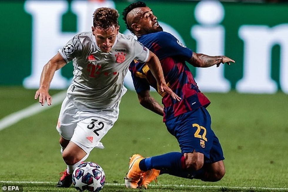 Arturo Vidal, beaten here by Joshua Kimmich, is surely on his way out of Barca this summer