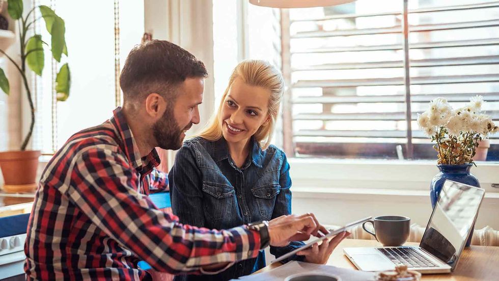 attractive young couple discussing about project