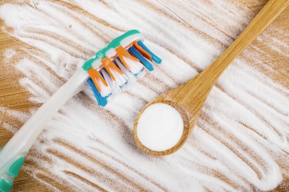 baking soda and toothbrush for natural teeth whitening