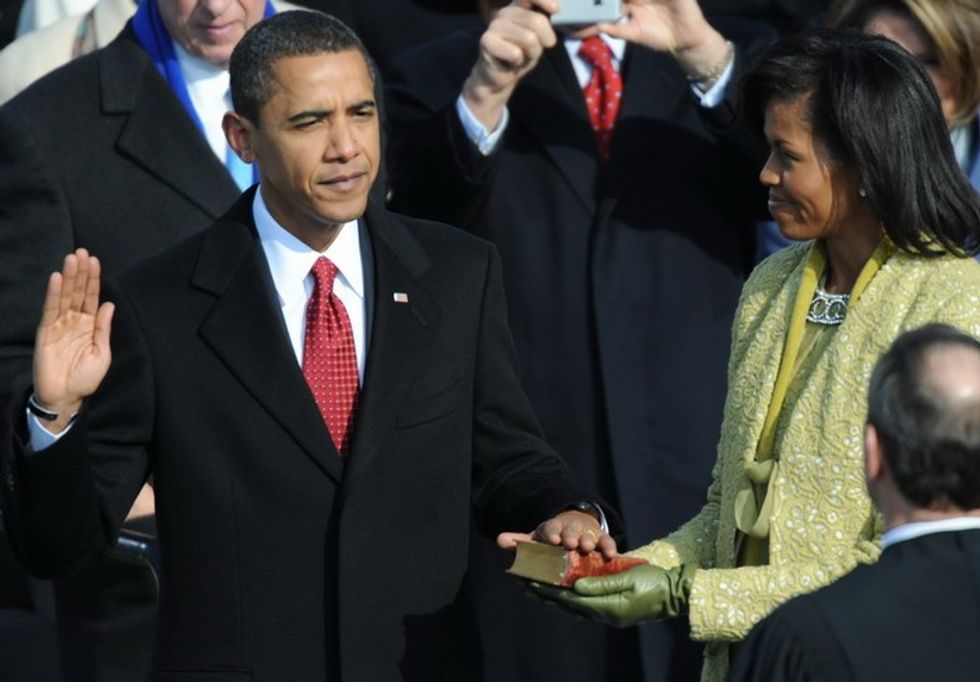 Barack Obama is sworn in as 44th US president by Chief Justice John Roberts beside wife Michelle on January 20, 2009 at the Capitol in Washington, DC. Obama took the oath on the same Bible used to swear in President Abraham Lincoln, after the presidential inaugural committee said the Lincoln Bible would be borrowed from the collections at the Library of Congress. AFP PHOTO / Tim SLOAN (Photo credit should read TIM SLOAN/AFP/Getty Images)