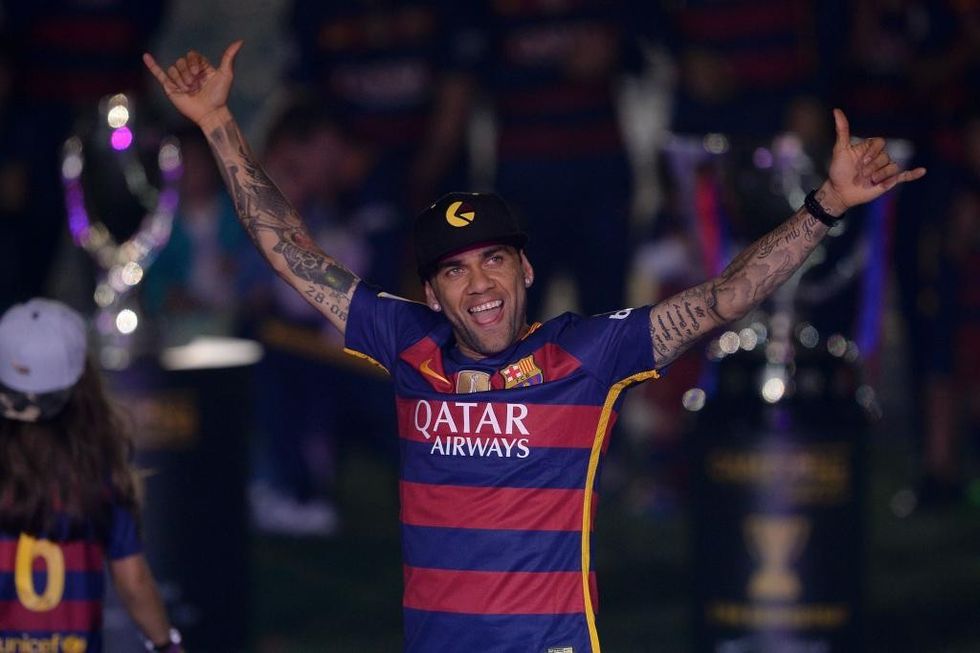 Barcelona's Brazilian defender Dani Alves acknowledges the crowd during celebrations at the Camp Nou stadium in Barcelona on May 23, 2016 following their Spanish