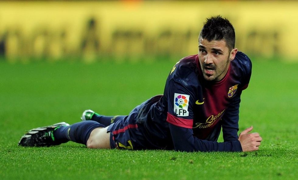 Barcelona's forward David Villa reacts during the Spanish league football match FC Barcelona vs Atletico de Madrid at the Camp Nou stadium in Barcelona on December 16, 2012. AFP PHOTO / LLUIS GENE.