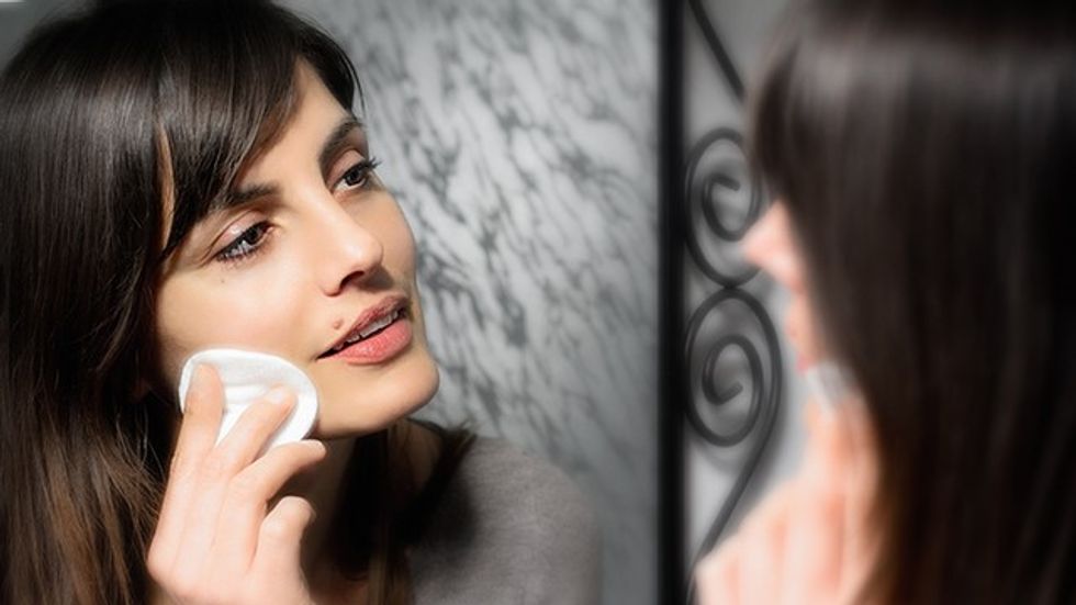 beautiful girl cleansing skin face