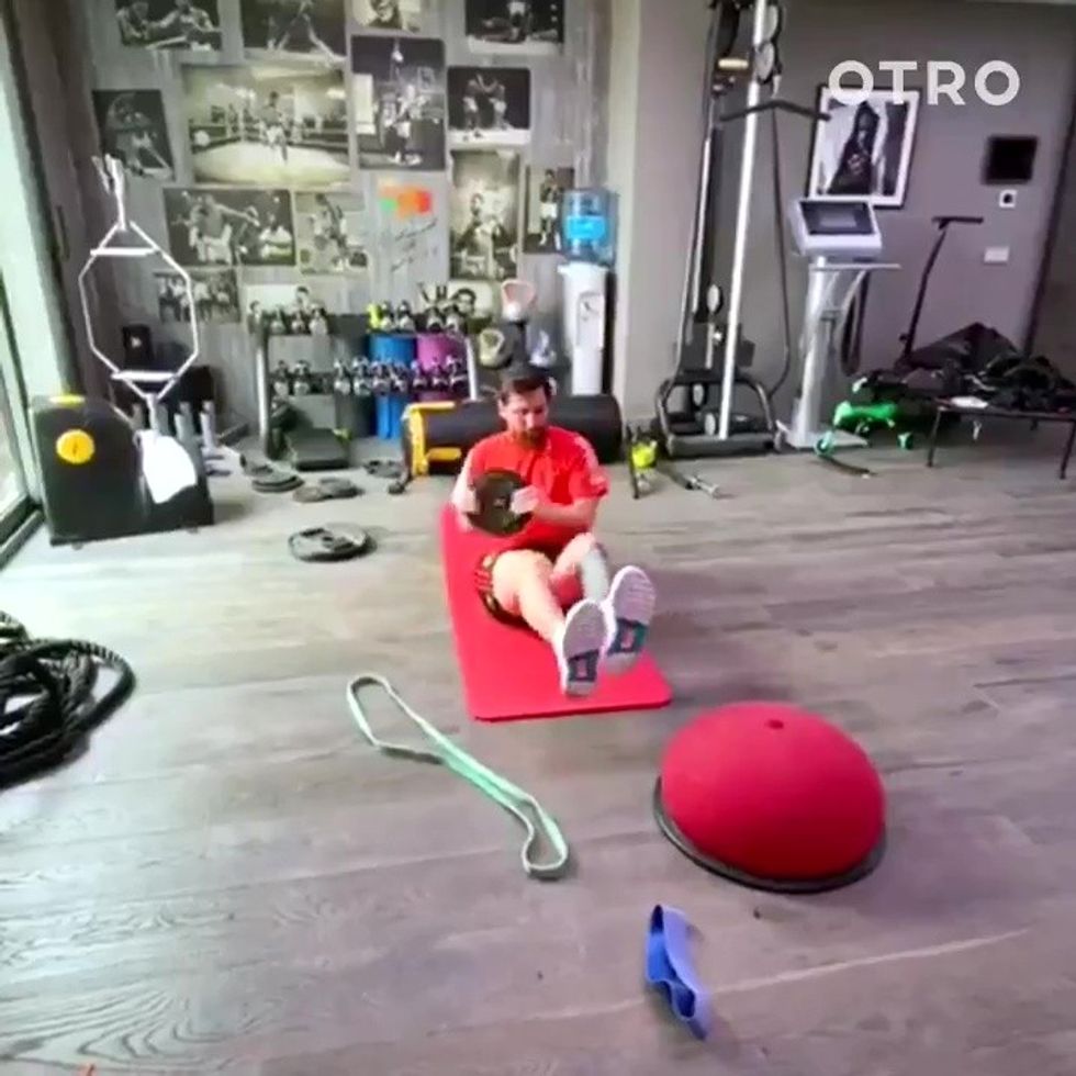 Behind Messi is a shrine to Muhammad Ali