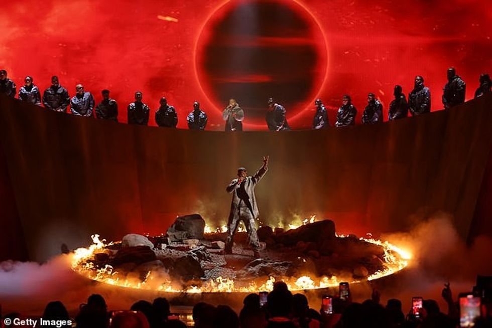 'Believe me, they tried to bleed Will Smith. / In the rearview, I see adversity was the gift,' the Fresh Prince of Bel Air alum rapped as he stood in a circle of fire on the Peacock Theater stage