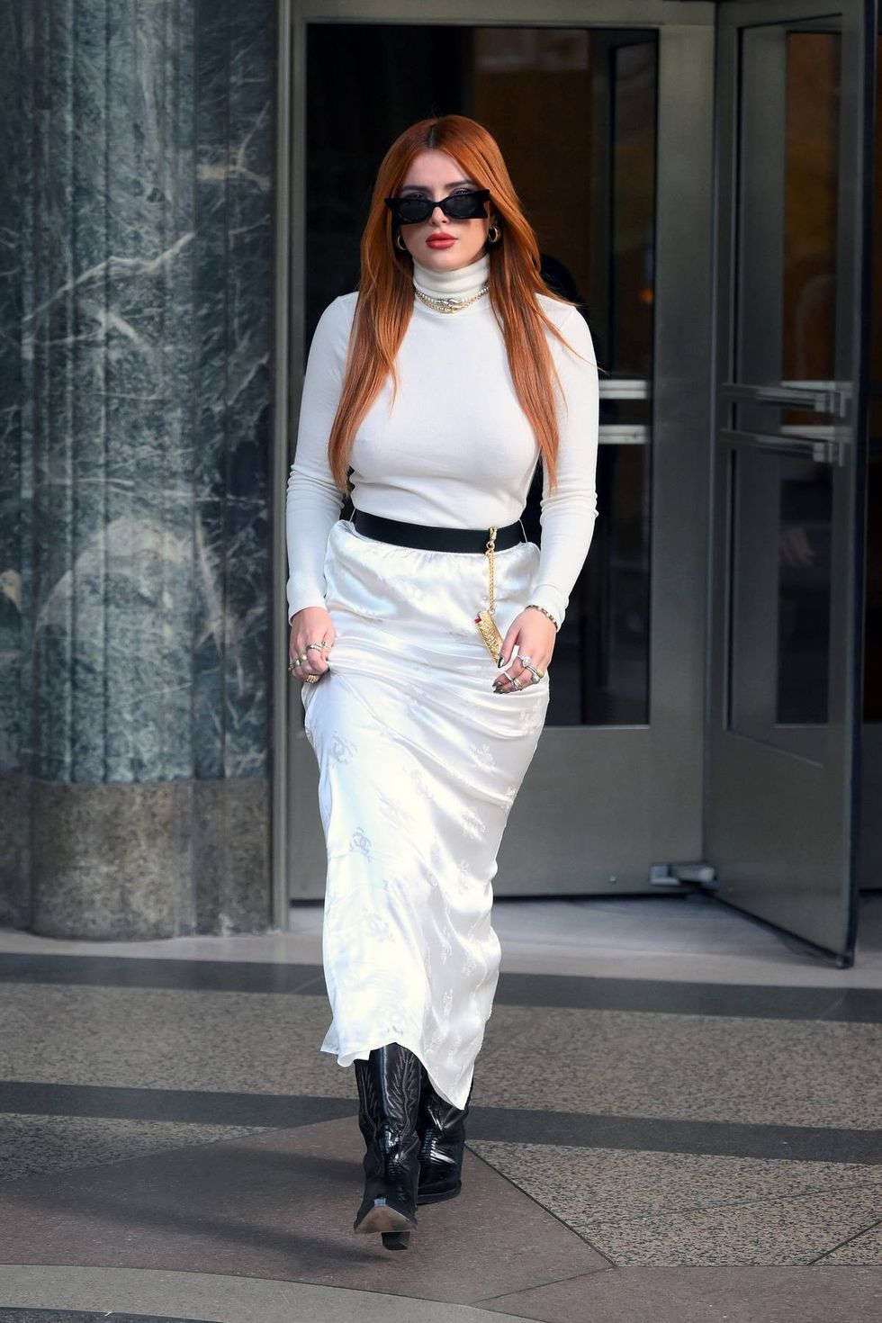 bella thorne looks fab in a long white dress as she leaves an office building in new york city 05122 4