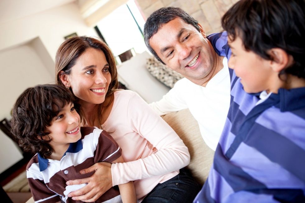 bigstock-family-talking-and-a-boy-telli-339223882