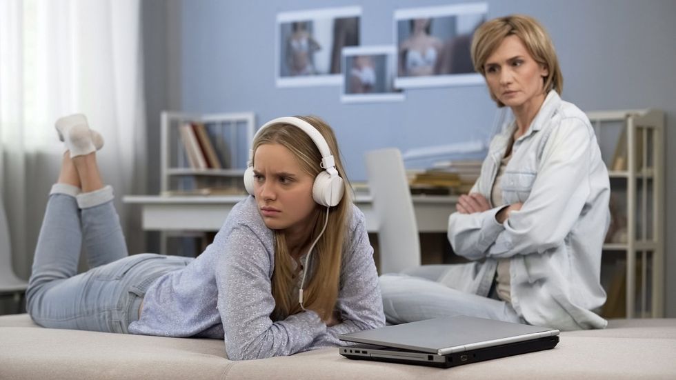 bigstock Offended Girl In Headphones Ig 348918733