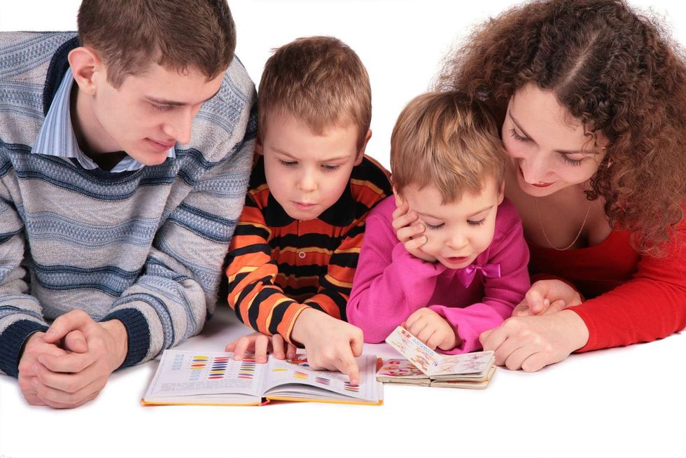 bigstock Parents With Children Read Boo 2823943
