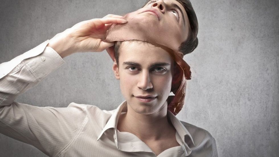 bigstock Young man taking off a mask 31981589