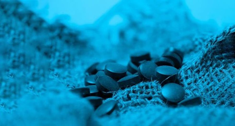 blue chlorella spirulina tablets close 260nw 1861132963