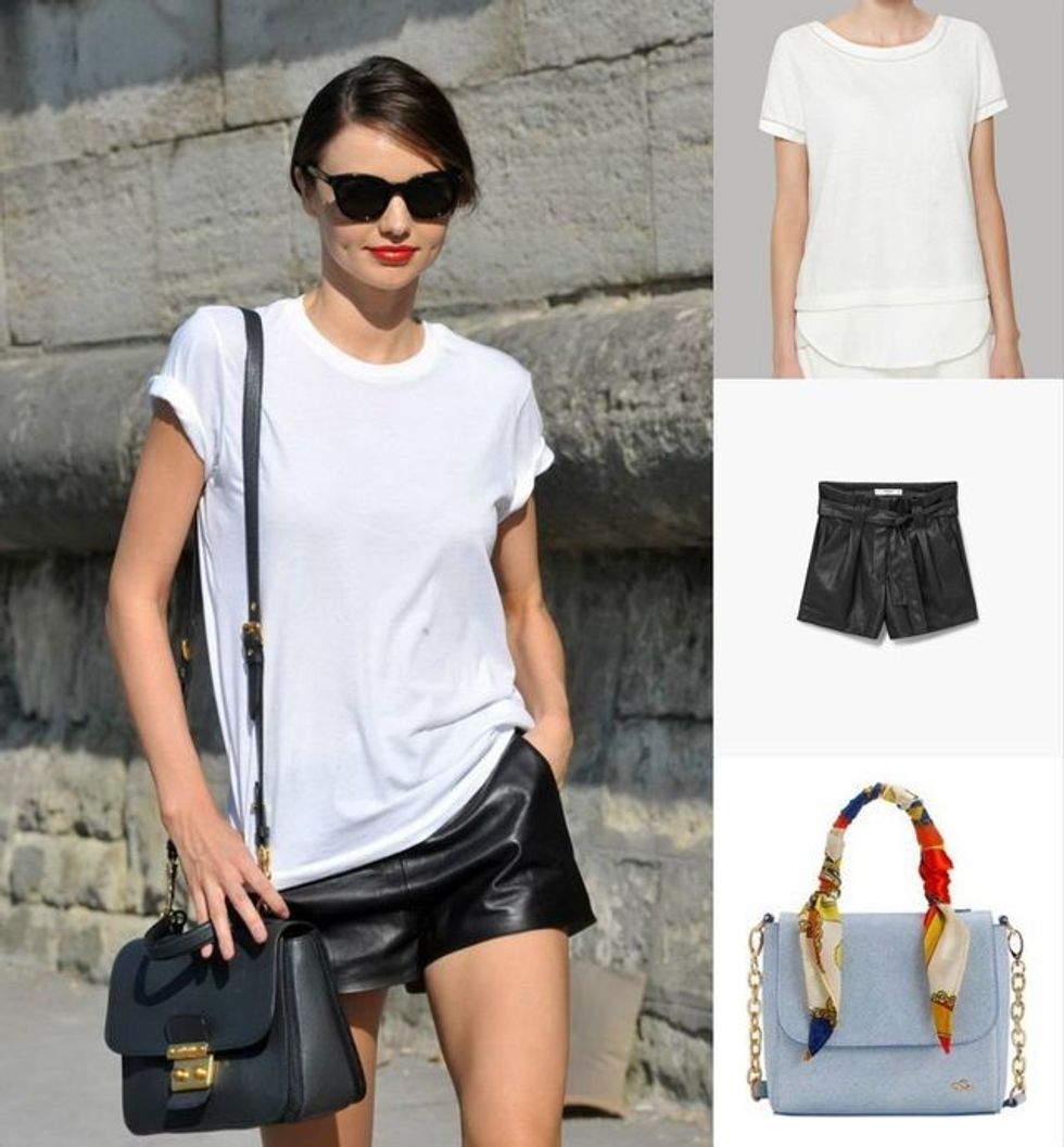 Bluzë e bardhë, pantallona të shkurtra lëkurë dhe çantë e vogël me rrip të gjatë