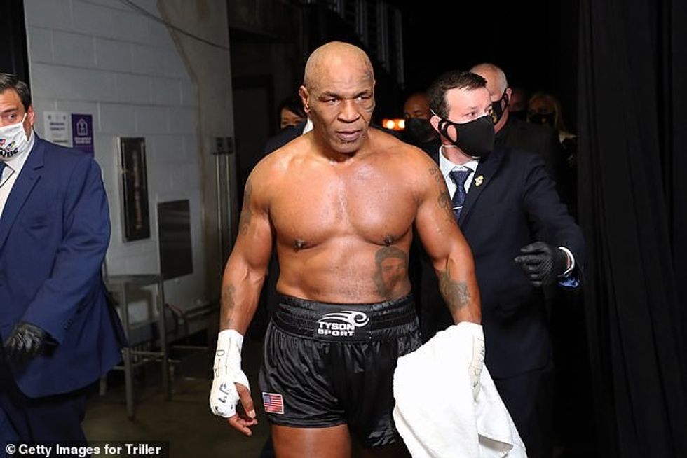 Boxing legend Mike Tyson will be fighting again in September, his coach has confirmed