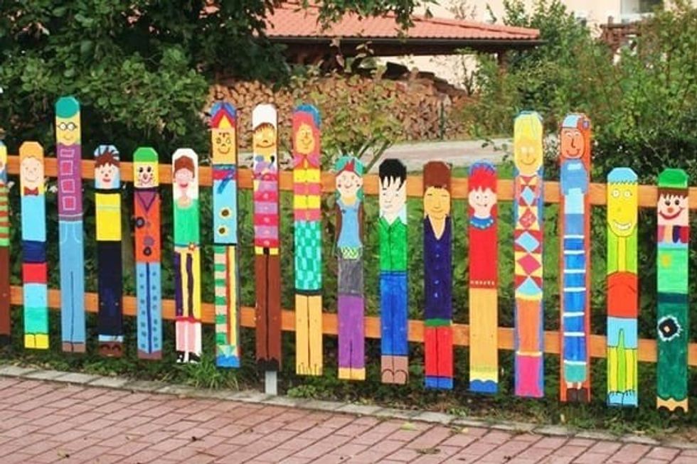 Brightly coloured fence people