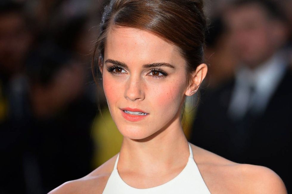 British actress Emma Watson poses for pictures on the red carpet as she arrive for the UK premiere of her latest film