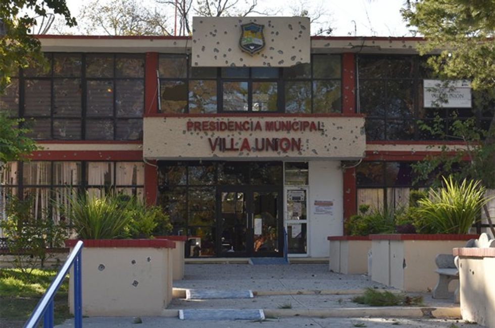 bullet riddled building