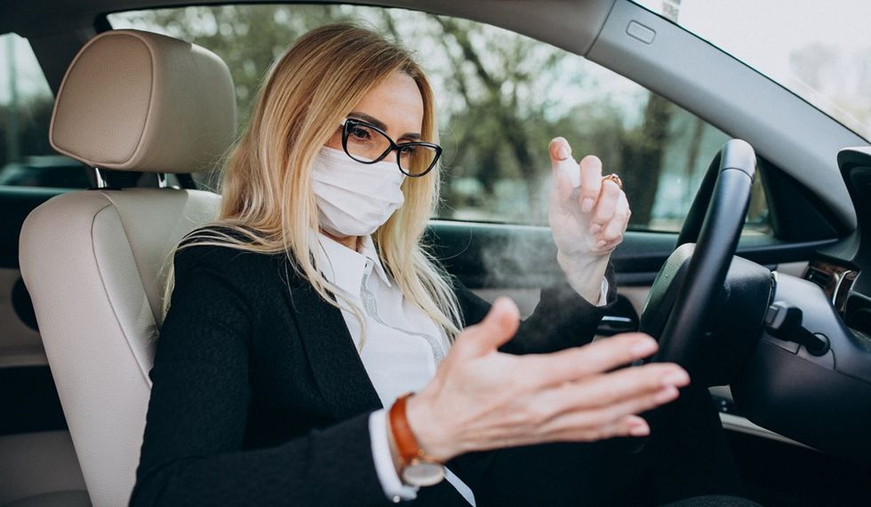 business woman protection mask sitting insid