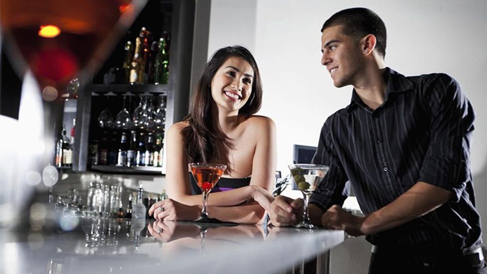 cheerful couple restaurant glasses red wine