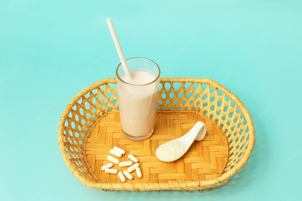 collagen powder milk pills blue background 92397 1571