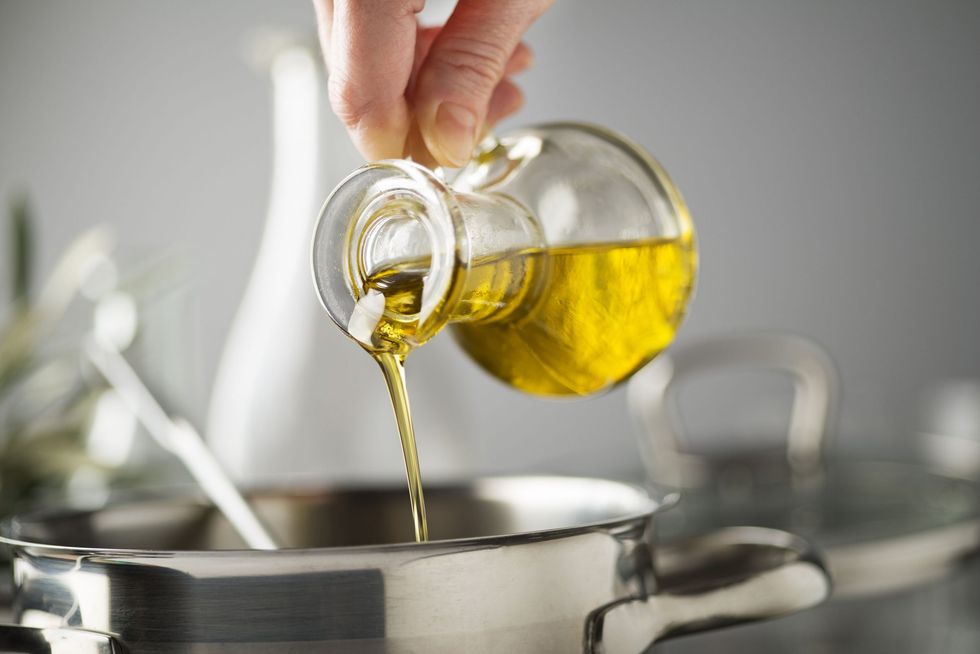 cooking meal in a pot with olive oil royalty free image 1626099205 scaled