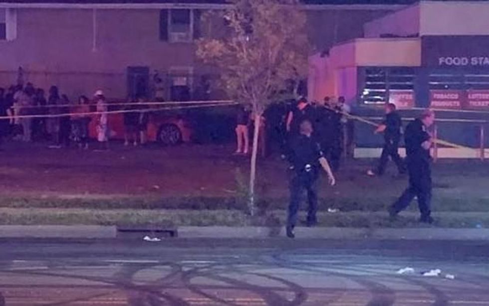 Cops arrived at the scene on Beatties Ford Road in northern Charlotte to find hundreds of people in the street