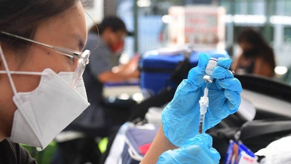 coronavirus vaccine la 092221getty biz labor vax mandate