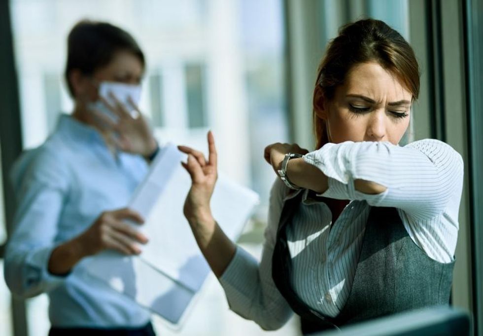 coughing office worker
