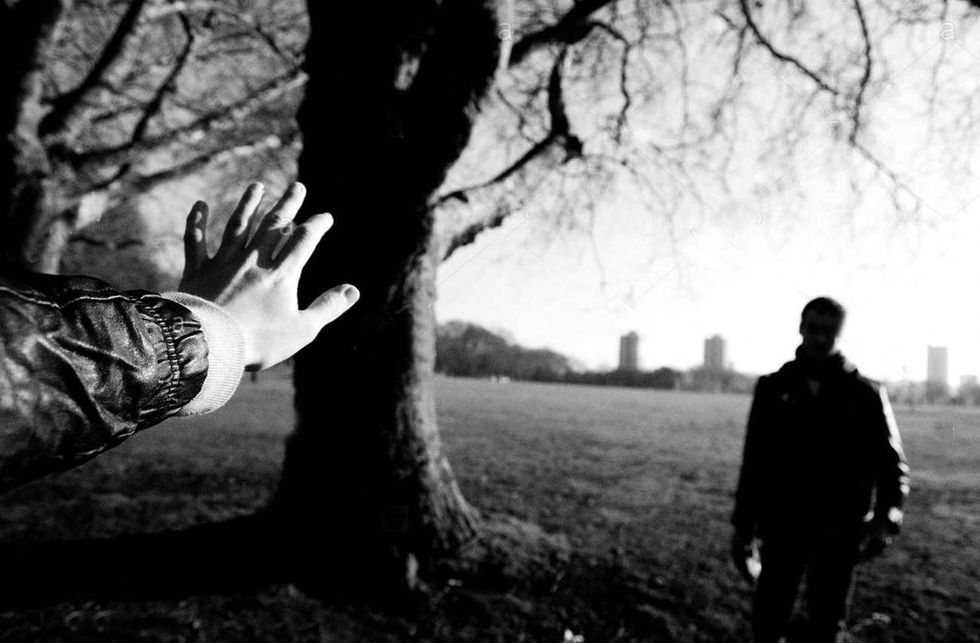 couple getting separated in a park london DFEN3N