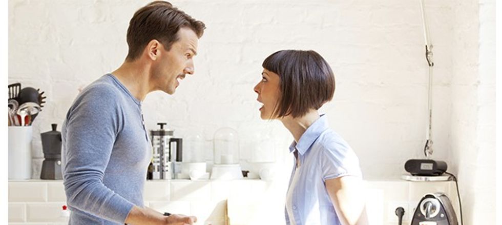 Couple having a discussion in the kitchen