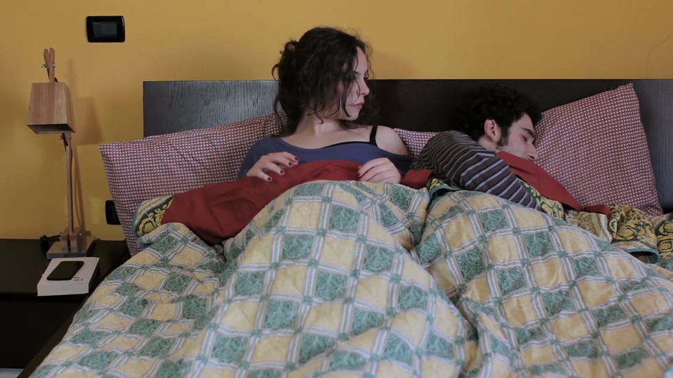 couple problem woman using mobile phone in the bed with her partner betrayal npdhp hfe F0000